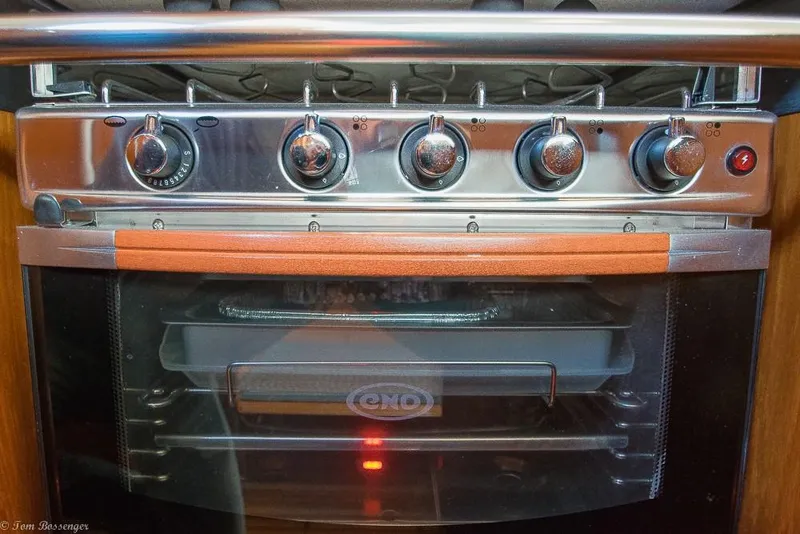 Slide: The Image of A modern oven with five dials and a glass door design in a yacht kitchen. - 16