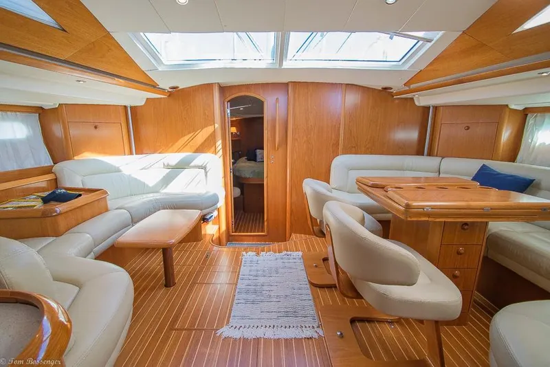 Slide: The Image of Interior of a 2006 Jeanneau Sun Odyssey 54 DS with elegant wood accents and comfortable seating. - 18