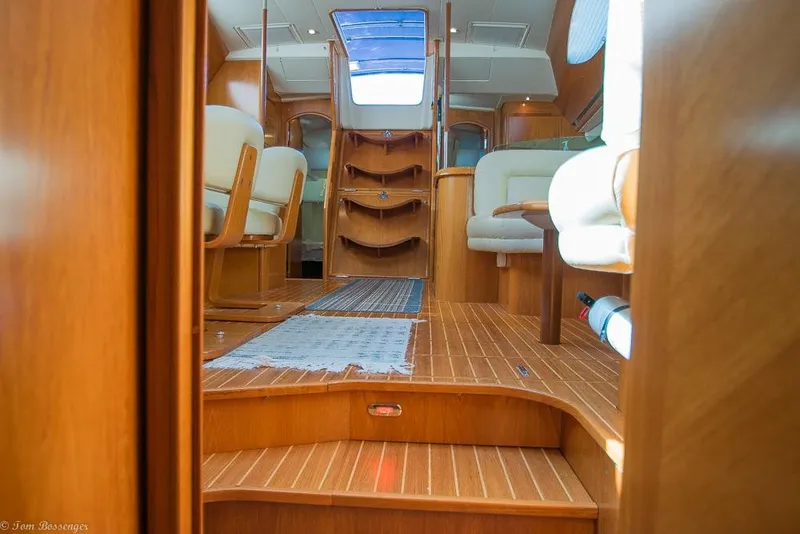 Slide: The Image of Interior of a 2006 Jeanneau Sun Odyssey 54 DS with wooden floors and comfortable seating. - 23