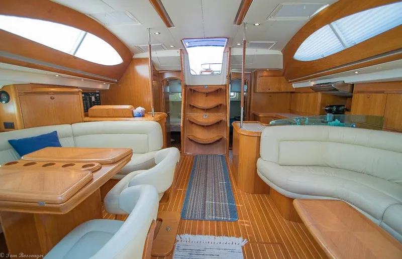 Slide: The Image of Interior of the 2006 Jeanneau Sun Odyssey 54 DS with elegant wood furnishings and comfortable seating. - 24