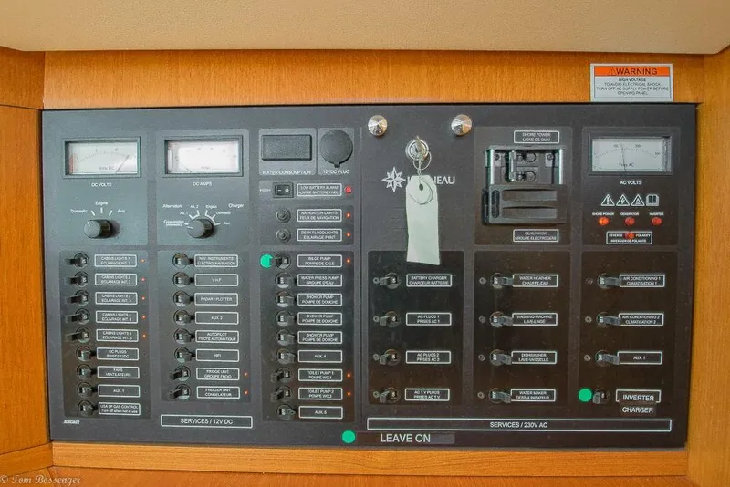 Slide: The Image of Electrical control panel on a 2006 Jeanneau Sun Odyssey 54 DS with various switches and gauges. - 30