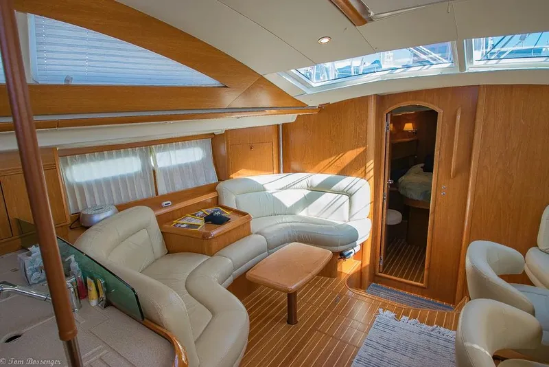 Slide: The Image of Interior of a 2006 Jeanneau Sun Odyssey 54 DS with elegant wood accents and comfortable seating. - 5