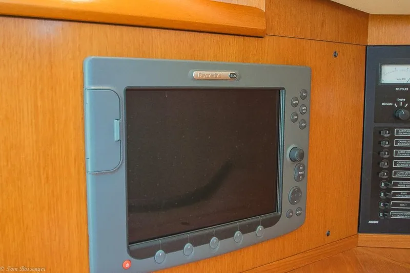 Slide: The Image of A navigation system is embedded in wood paneling, next to a control panel with switches. - 29