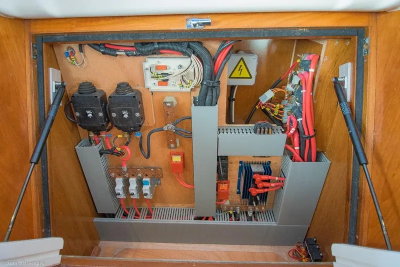 Slide: The Image of Electrical panel on a 2006 Jeanneau Sun Odyssey 54 DS, featuring wires and fuses. - 38
