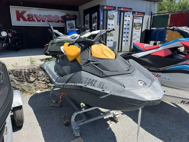 Slide: The Image of A gray Sea-Doo Spark jet ski is on a stand. - 2