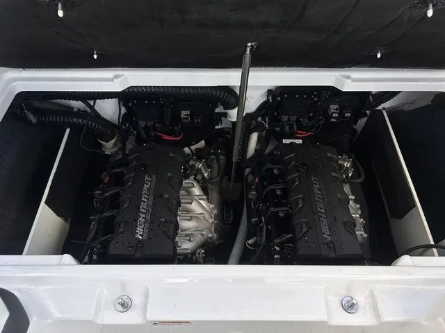 Slide: The Image of Two powerful engines inside a 2023 Yamaha 222SE boat. - 17