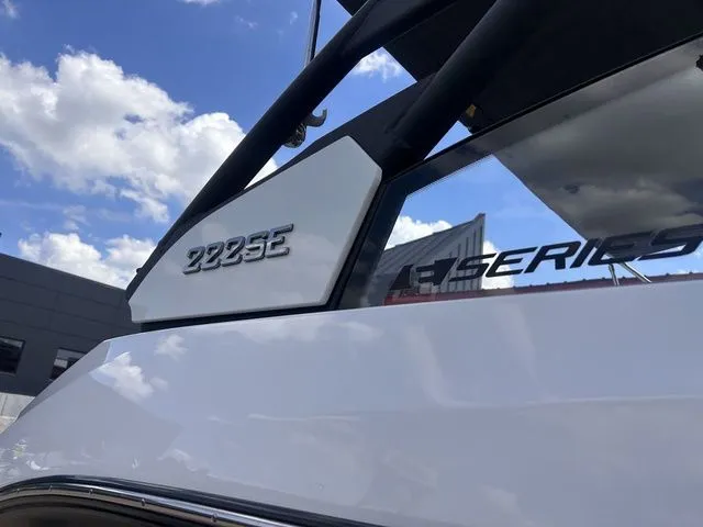 Slide: The Image of Close-up of a white Yamaha 222SE boat with a glossy finish and blue sky in the background. - 8