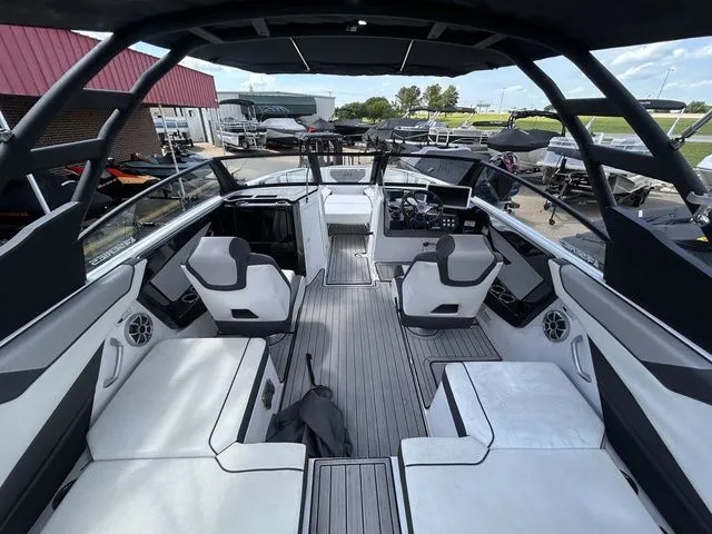 Slide: The Image of The image shows the interior of a modern boat with stylish seating and sleek design. - 10