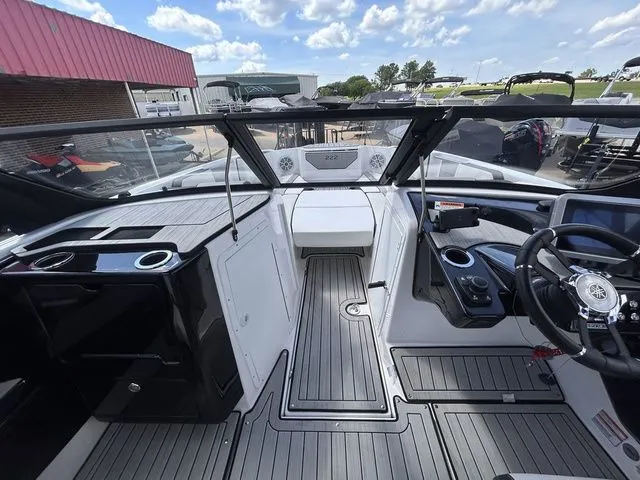 Slide: The Image of The image shows the cockpit of a 2023 Yamaha 222SE boat with modern controls and seating. - 11