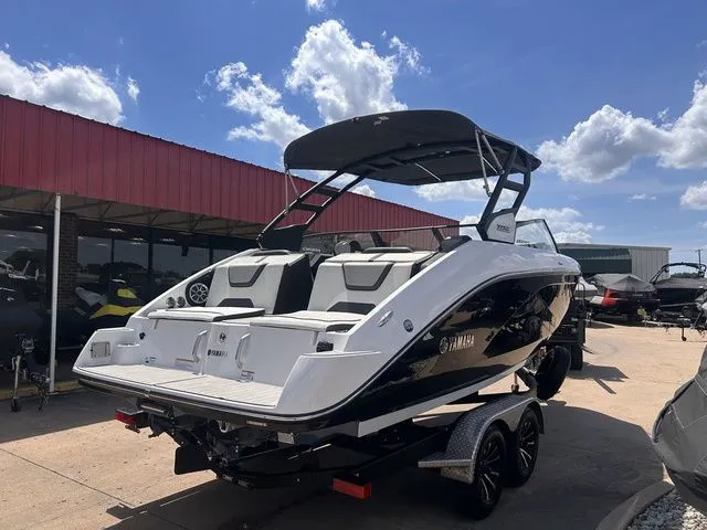 Slide: The Image of A 2023 Yamaha 222SE boat on a trailer under a sunny sky. - 5
