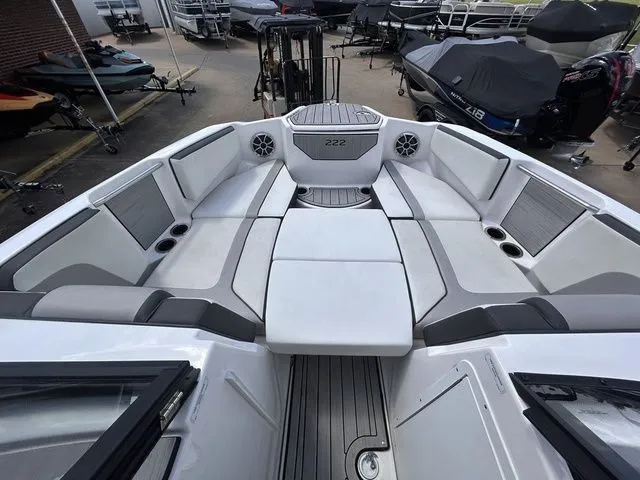 Slide: The Image of The image shows the spacious bow area of a Yamaha 222SE boat with cushioned seating. - 14