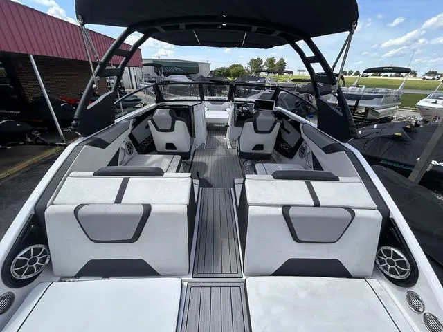 Slide: The Image of Interior view of a modern boat with white seating and a black canopy. - 9