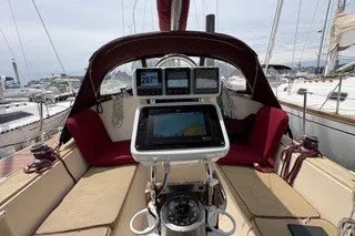 Slide: The Image of 1990 Island Packet 27 sailboat cockpit with navigation equipment and seating. - 1