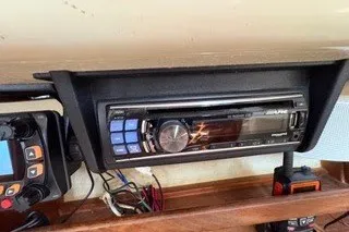 Slide: The Image of 1990 Island Packet 27 boat interior with stereo system and navigation equipment. - 39