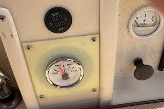 Slide: The Image of Control panel of a 1990 Island Packet 27 sailboat with gauges and switches. - 53