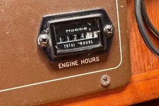 Slide: The Image of Hobbs meter showing 1124 engine hours on 1990 Island Packet 27 sailboat. - 44
