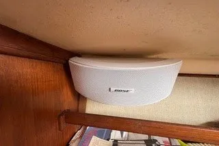 Slide: The Image of Bose speaker mounted inside a 1990 Island Packet 27 sailboat cabin. - 31