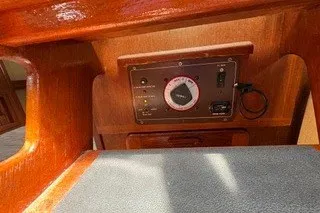 Slide: The Image of Control panel on 1990 Island Packet 27 sailboat with wooden interior. - 19