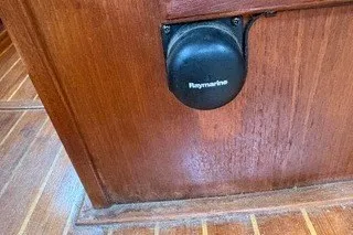 Slide: The Image of Raymarine device on 1990 Island Packet 27 wooden interior. - 50