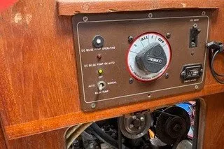Slide: The Image of Control panel of a 1990 Island Packet 27 sailboat with bilge pump settings. - 43