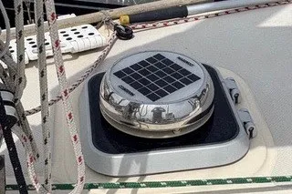 Slide: The Image of Solar vent on 1990 Island Packet 27 sailboat deck with ropes and fittings. - 54