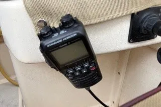 Slide: The Image of VHF radio mounted on a 1990 Island Packet 27 sailboat dashboard. - 51