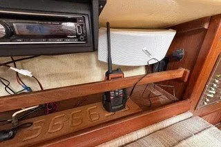 Slide: The Image of Interior of 1990 Island Packet 27 sailboat with radio and speaker setup. - 40