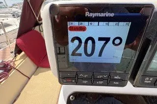 Slide: The Image of Raymarine navigation display showing 207° on a 1990 Island Packet 27 sailboat. - 12
