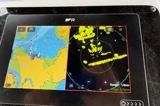 Slide: The Image of Navigation display on a 1990 Island Packet 27 sailboat, showing radar and chart data. - 47