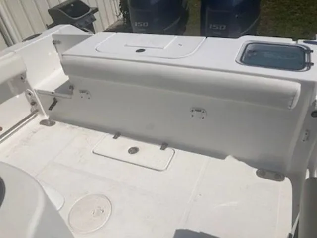 Slide: The Image of The image shows the deck of a 2016 Sea Hunt Gamefish 25 boat with two outboard motors. - 6