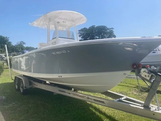 Slide: The Image of A gray 2016 Sea Hunt Gamefish 25 boat on a trailer outdoors. - 3