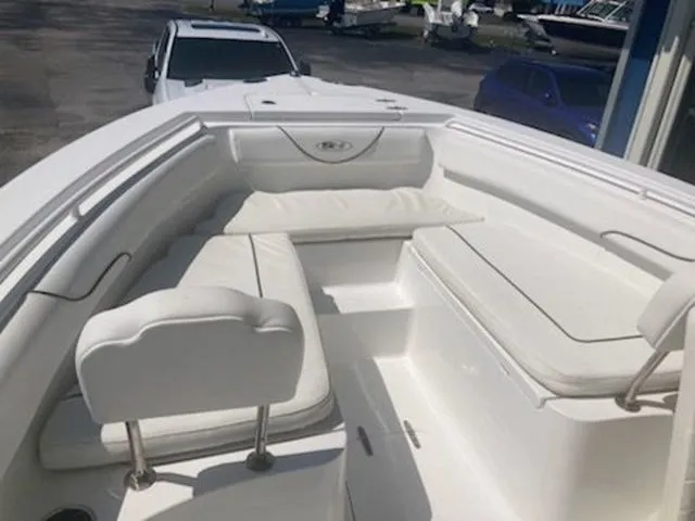Slide: The Image of The image shows the bow area of a 2016 Sea Hunt Gamefish 25 boat with white cushions. - 4