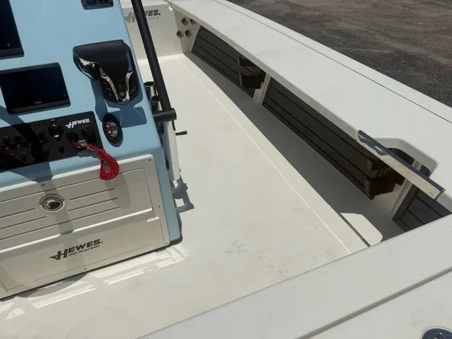 Slide: The Image of The image shows the cockpit of a 2027 Hewes Redfisher 21 boat with a helm console. - 11