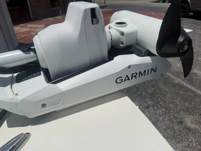Slide: The Image of Close-up of a white Garmin device on a boat. - 14