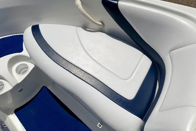 Slide: The Image of 2004 Bombardier SEADOO Utopia 185 boat interior with white and blue seating. - 37