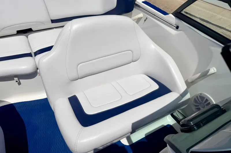 Slide: The Image of 2004 Bombardier SEADOO Utopia 185 boat interior with white and blue seating. - 25