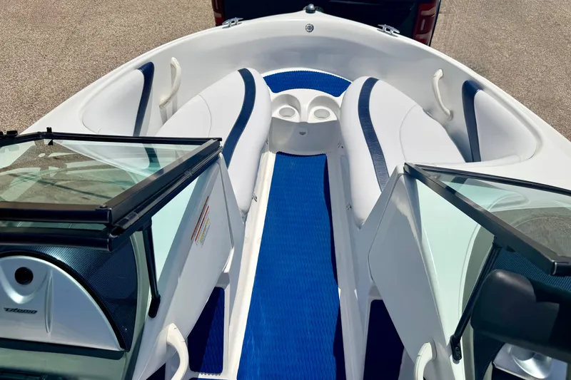 Slide: The Image of 2004 Bombardier SEADOO Utopia 185 boat interior with blue and white seating. - 34