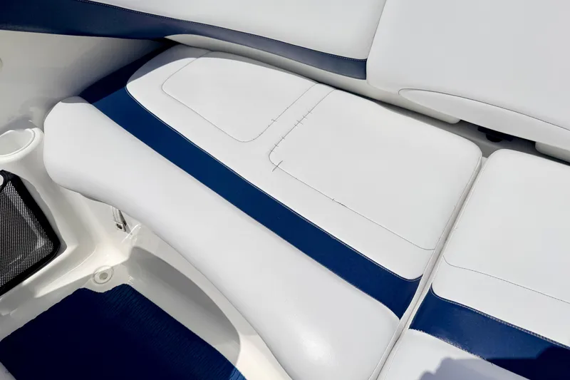 Slide: The Image of 2004 Bombardier SEADOO Utopia 185 boat interior with white and blue seating. - 17