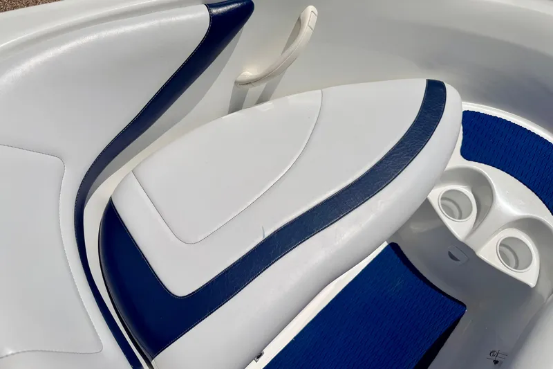 Slide: The Image of 2004 Bombardier SEADOO Utopia 185 boat interior with white and blue seating. - 35