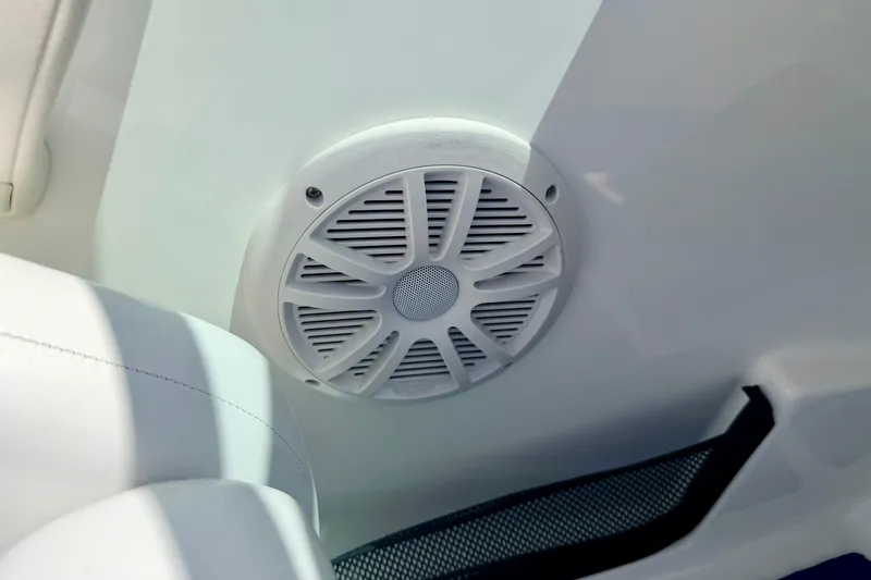 Slide: The Image of Speaker on 2004 Bombardier SEADOO Utopia 185 boat interior, white upholstery. - 31