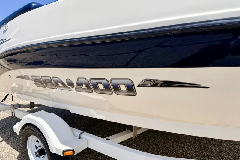 Slide: The Image of 2004 Bombardier SEADOO Utopia 185 boat on trailer, side view. - 8