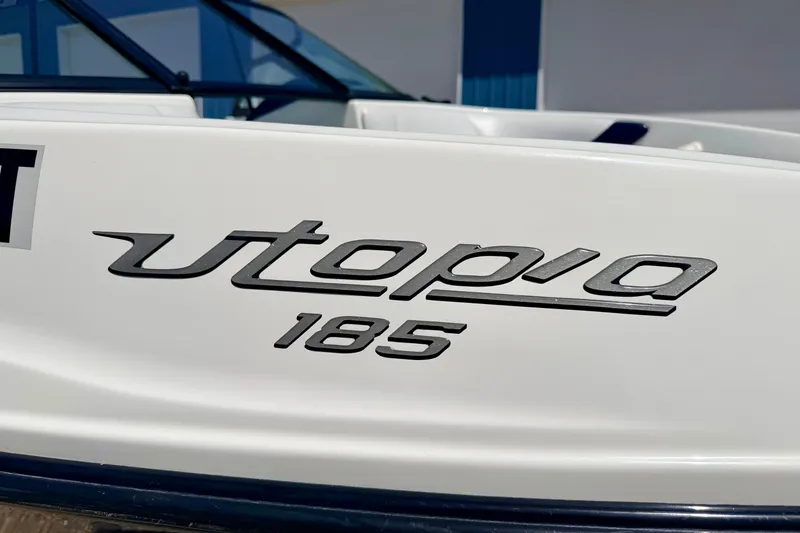 Slide: The Image of 2004 Bombardier SEADOO Utopia 185 boat logo on white surface. - 7
