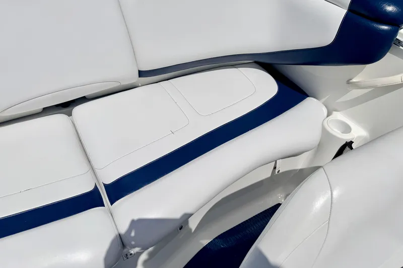 Slide: The Image of 2004 Bombardier SEADOO Utopia 185 boat interior with white and blue seating. - 18