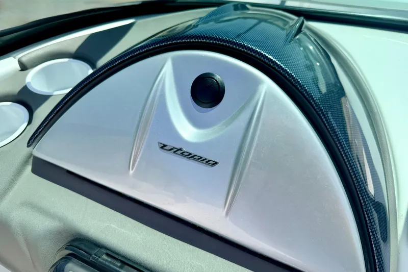 Slide: The Image of Dashboard of a 2004 Bombardier SEADOO Utopia 185 boat, featuring sleek design elements. - 28