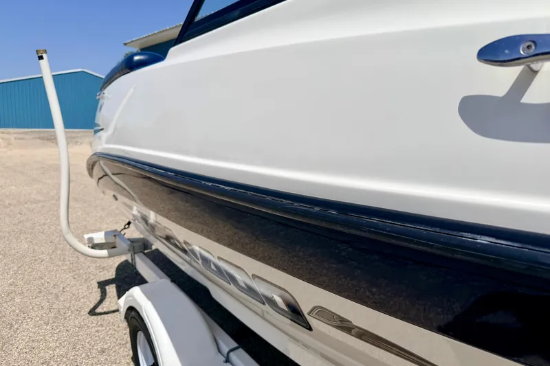 Slide: The Image of 2004 Bombardier SEADOO Utopia 185 boat on trailer, side view, outdoors. - 9