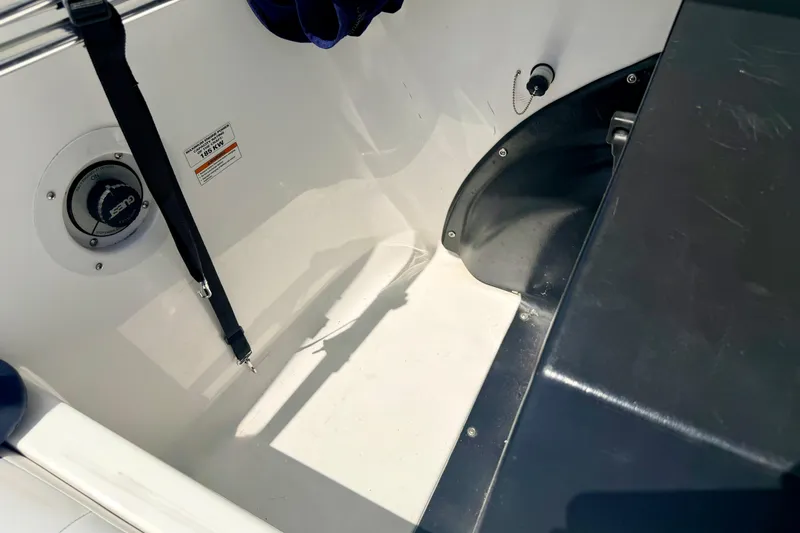 Slide: The Image of Interior view of a 2004 Bombardier SEADOO Utopia 185 boat, featuring seating and safety equipment. - 42