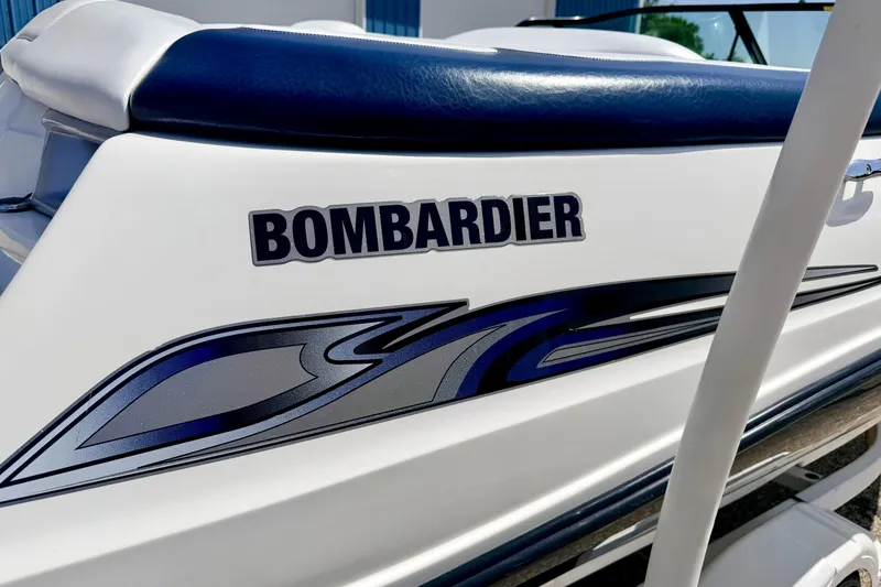 Slide: The Image of 2004 Bombardier SEADOO Utopia 185 boat with sleek design and blue accents. - 10