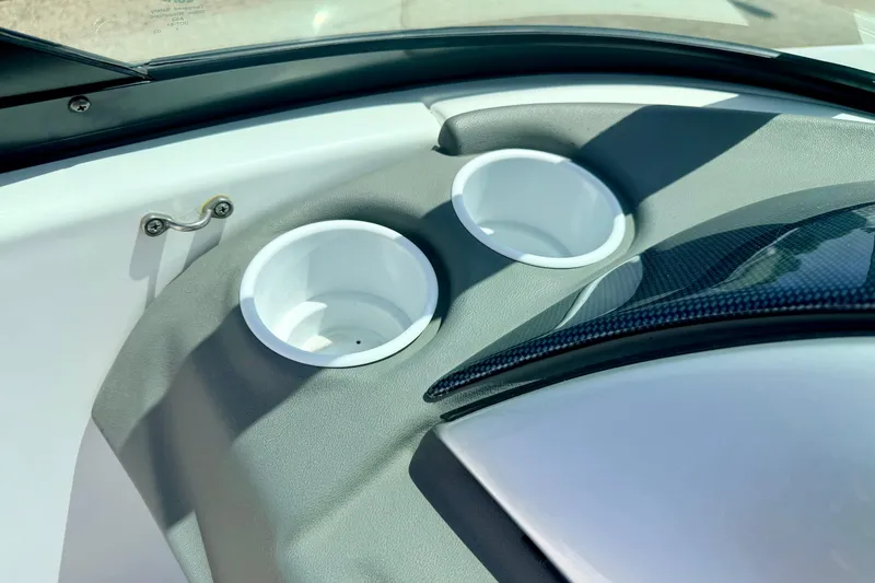 Slide: The Image of 2004 Bombardier SEADOO Utopia 185 boat interior with dual cup holders. - 30