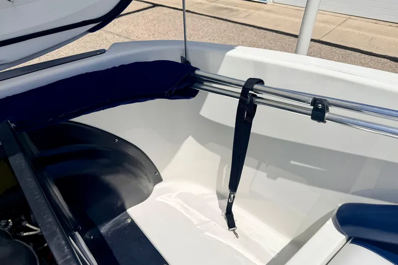 Slide: The Image of 2004 Bombardier SEADOO Utopia 185 interior detail with storage compartment and safety strap. - 45