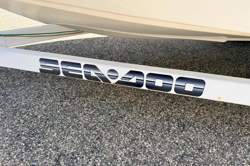 Slide: The Image of 2004 Bombardier SEADOO Utopia 185 trailer with logo on pavement background. - 50